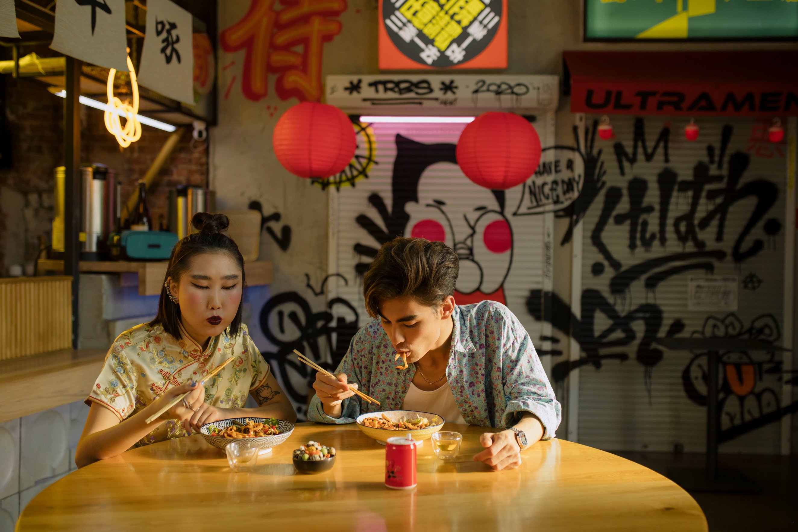 Couple Eating Bowl of Noodles